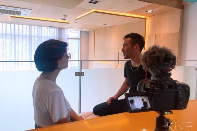 Two people sitting in front of a camera talking about SMILE eye surgery